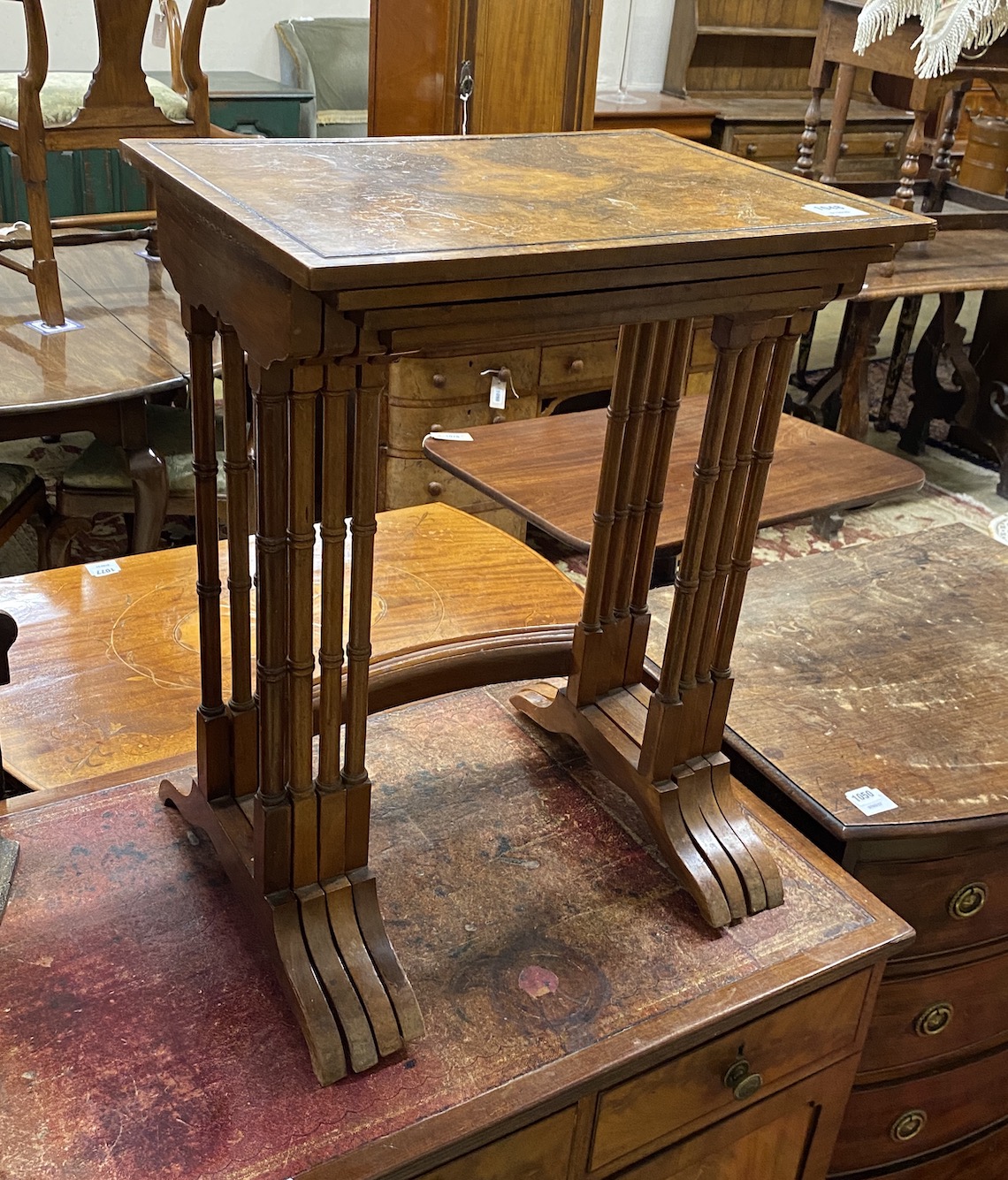 A quartetto of rectangular figured walnut tea tables, width 51cm, depth 35cm, height 64cm